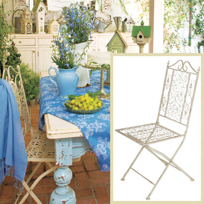 Outdoor patio dining room with iron folding chairs