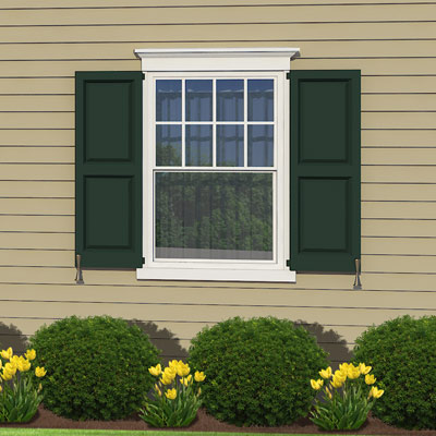 Lower window case topping along this colonial home 
