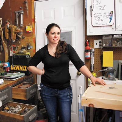 woman standing with salvage materials
