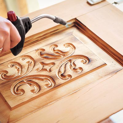 burnishing door panel with blowtorch