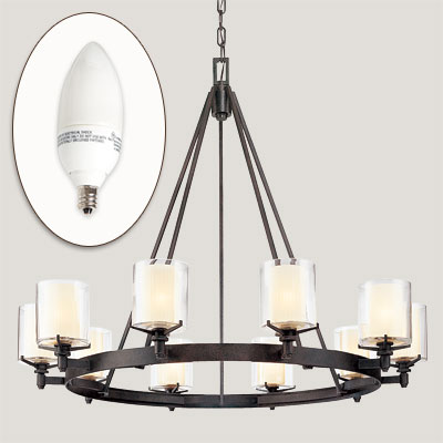 hand holding CFL near light fixture for efficient lighting