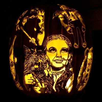the characters from The Wizard of Oz carved into a pumpkin