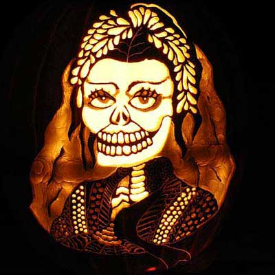 a Frida Kahlo-inspired portrait carved into a pumpkin