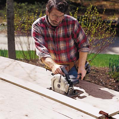 man using circular saw