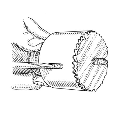 illustration of ejecting plug from hole saw