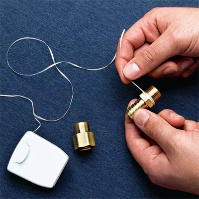 dental floss used to hang picture frames