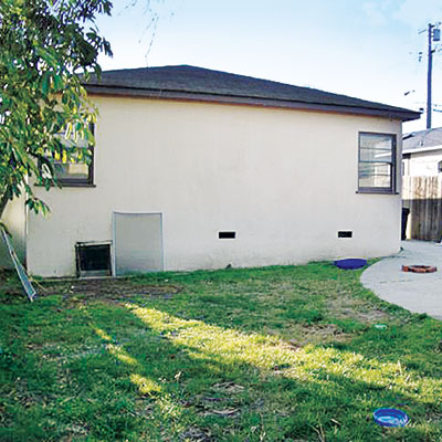 backyard of this bungalow before remodel
