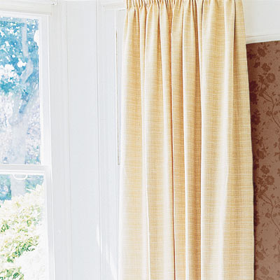 living room with textured curtains