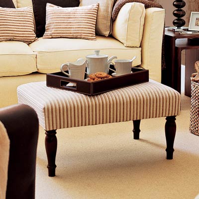 living room with upholstered ottoman