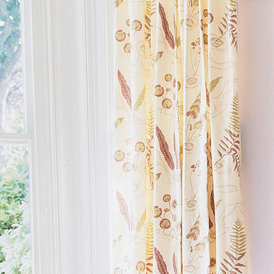 living room with botanical print textiles