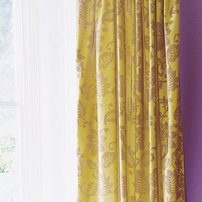 living room with damask style textiles