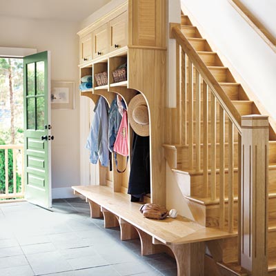 mudroom with locker lined stair wall
