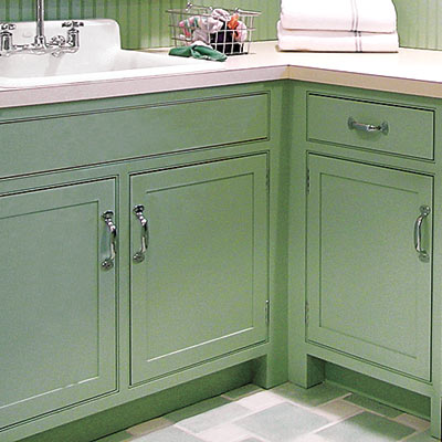 bright and spacious laundry room with kitchen worthy cabinetry 