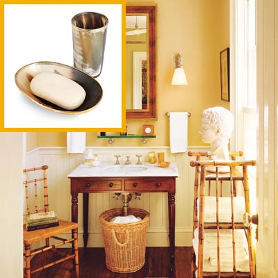 a half-bath furnished with Colonial details, metal soap dish and drinking tumbler inset