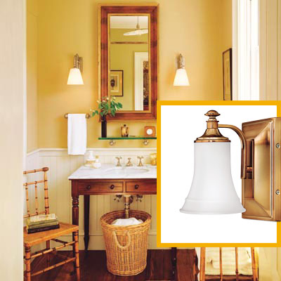 a half-bath furnished with Colonial details, bath sconce inset