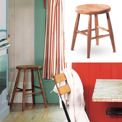 colorful cottage kitchen with round wooden stool