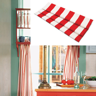 colorful cottage kitchen with red and white striped curtains