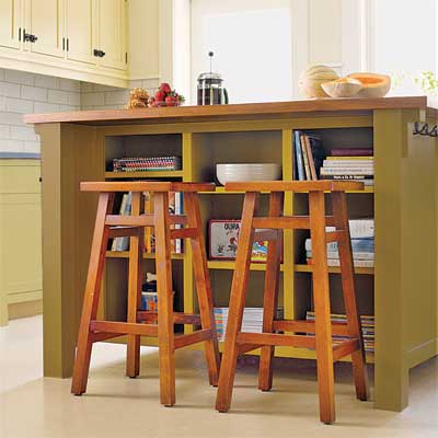 the walnut-topped island installed as part of this remodeled period look kitchen