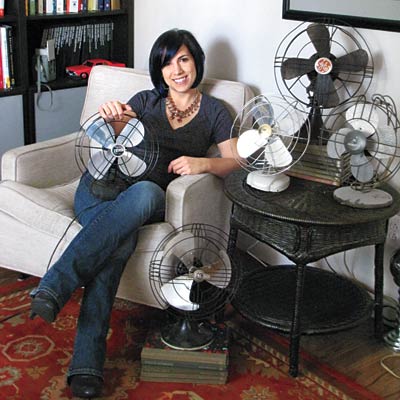 woman sitting with vintage fans