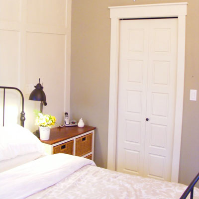 The Malinek's master bedroom with new paneled wall