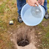 Testing garden site for water absorbency 