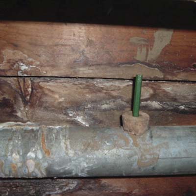 a cork and golf pencil in a drain pipe 