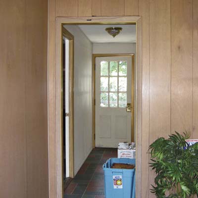before photo of hallway leading to the garage in Cape Cod remodel
