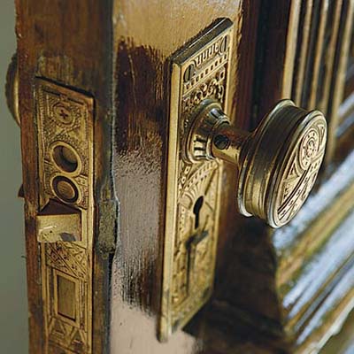 restored ornate cast-brass front door hardware