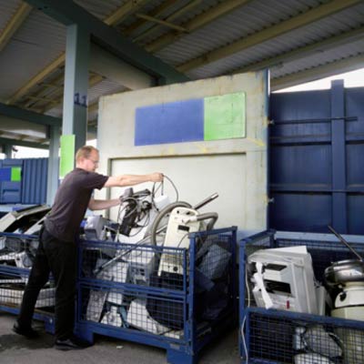 man recycling electronics