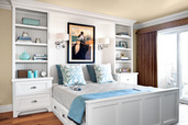 guest bedroom with white beadboard built-in nightstands and day bed