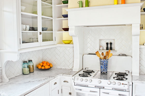 Wood Brackets used as Cabinet and Hood Supports as an example of Low-Cost Custom Details from Design Pros' Own Homes from this old house