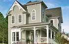 gothic revival style home with fiber cement siding  painted to look like wood clapboard