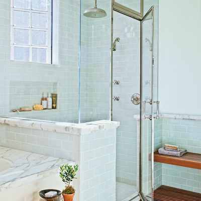 glass-enclosed shower with drying-off area with Japanese-style ipe-wood bench 