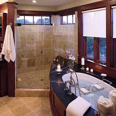 bath with black marble surround, wood accents