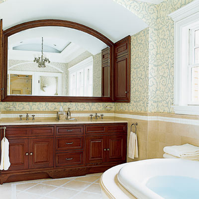 his and hers shared bathroom with wood vanity and wood framed mirror 