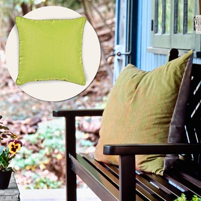 a porch with inset of a green throw pillow