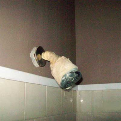 showerhead wrapped in tape from home inspection nightmares gallery twenty-seven