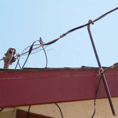 a steel crowbar hooked on the electrical main service from home inspection nightmares gallery twenty-seven