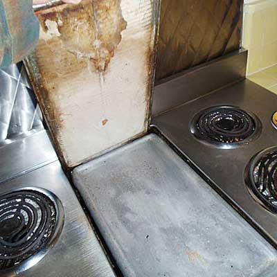 damaged asbestos cover, resting on the grill surface when in use from home inspection nightmares gallery twenty-seven