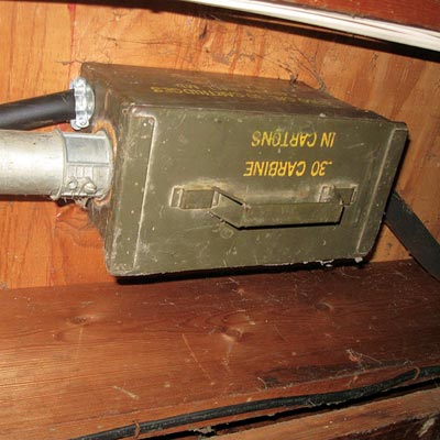 a metal box of ammo cartons converted into a junction box