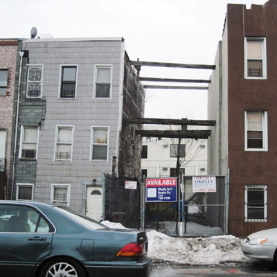 a gap between 2 narrow buildings connected by 2x's