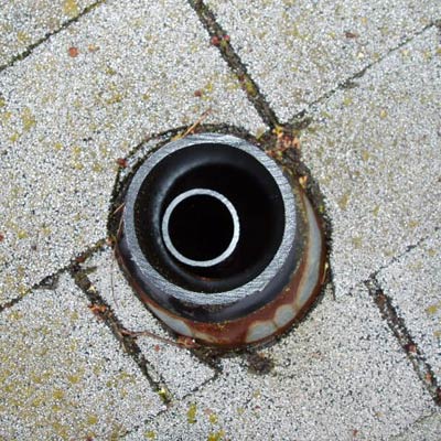 exposed plumbing vent on a roof