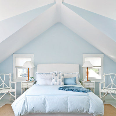 blue and white master bedroom with cathedral ceilings 