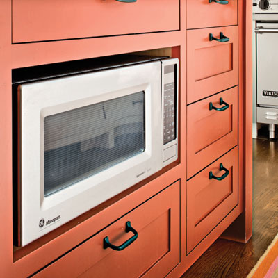 island with storage and microwave in this craftsman kitchen remodel