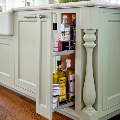 after kitchen remodel narrow pullout in kitchen island to store cooking oils 