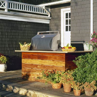 an outdoor kitchen near the back door to the patio