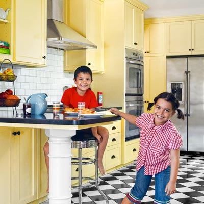 sunny yellow kitchen with classic cabinets, checkerboard floor