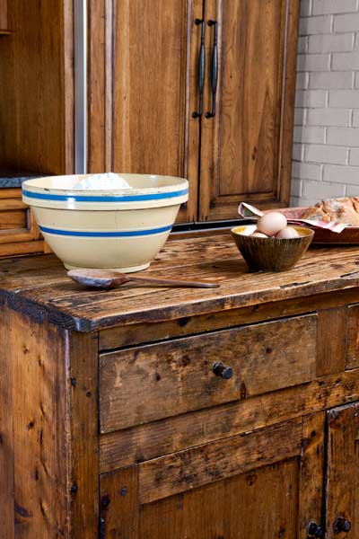 kitchen remodel after with antique sideboard as kitchen island