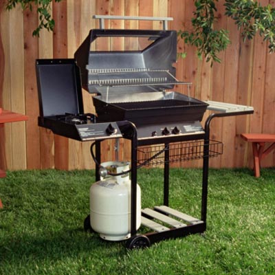 gas grill in backyard