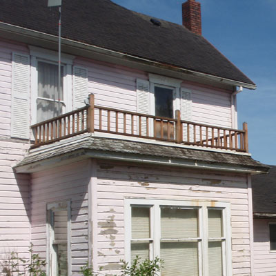 balcony on Queen Anne house in Tillamook, Oregon for sale through Save This Old House